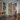 Stikits Interior Barn Door featuring natural wood planks, sliding on black hardware in a cozy living space.